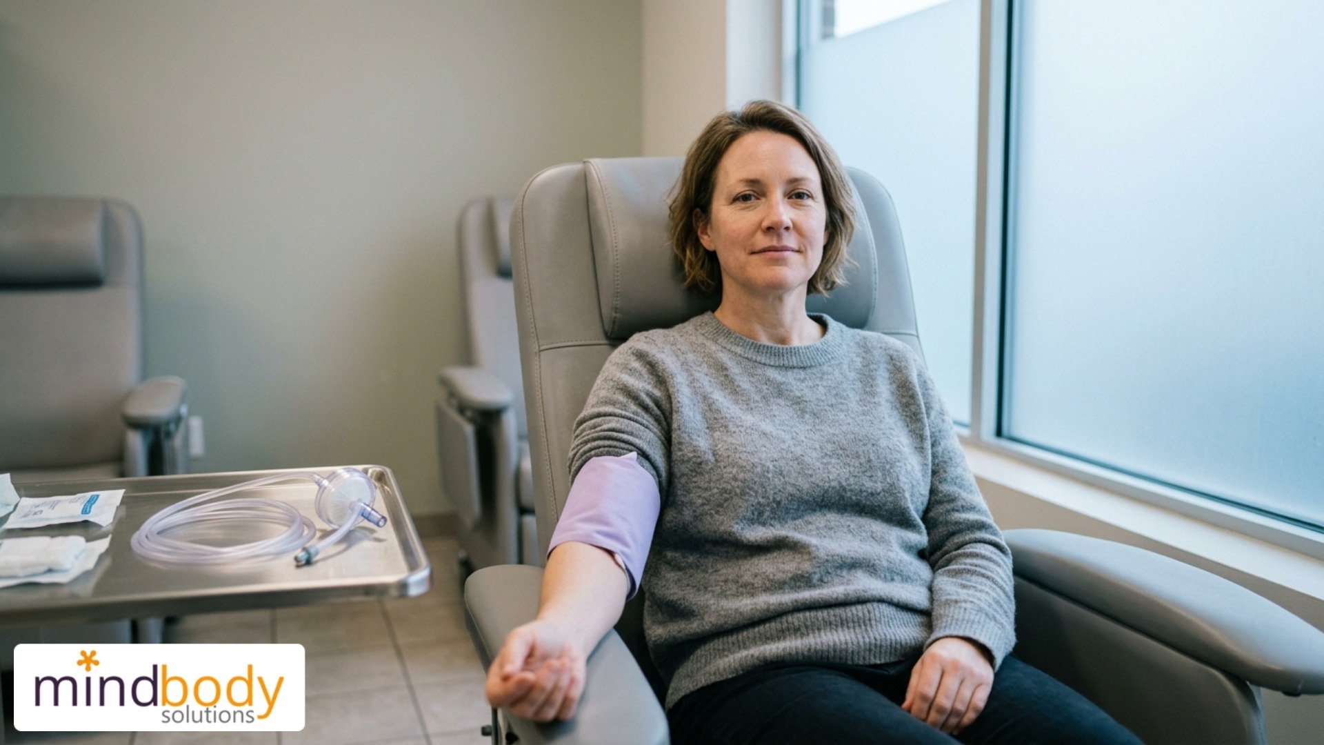 Woman receiving EBOO ozone blood treatment IV therapy for fatigue and brain fog